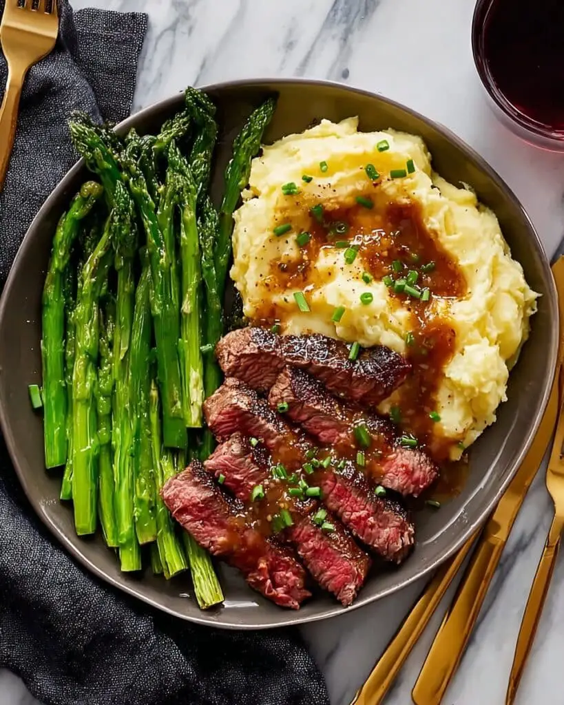 Bavette Steak with Roasted Garlic Pan Sauce and Mashed Potatoes Recipe