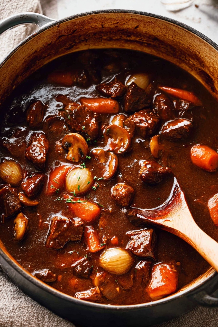 A large pot filled with a thick, dark brown stew containing visible chunks of browned meat, orange carrot slices, small whole pearl onions, and mushrooms, all coated in a shiny sauce. The stew is being stirred by a wooden spoon positioned on the right side inside the pot. The pot sits on a white marbled surface with a textured background of light fabric. Photo taken with an iphone --ar 2:3 --v 7 - Beef Bourguignon, Beef Burgundy, classic French beef stew, hearty beef stew recipe, slow cooker beef bourguignon