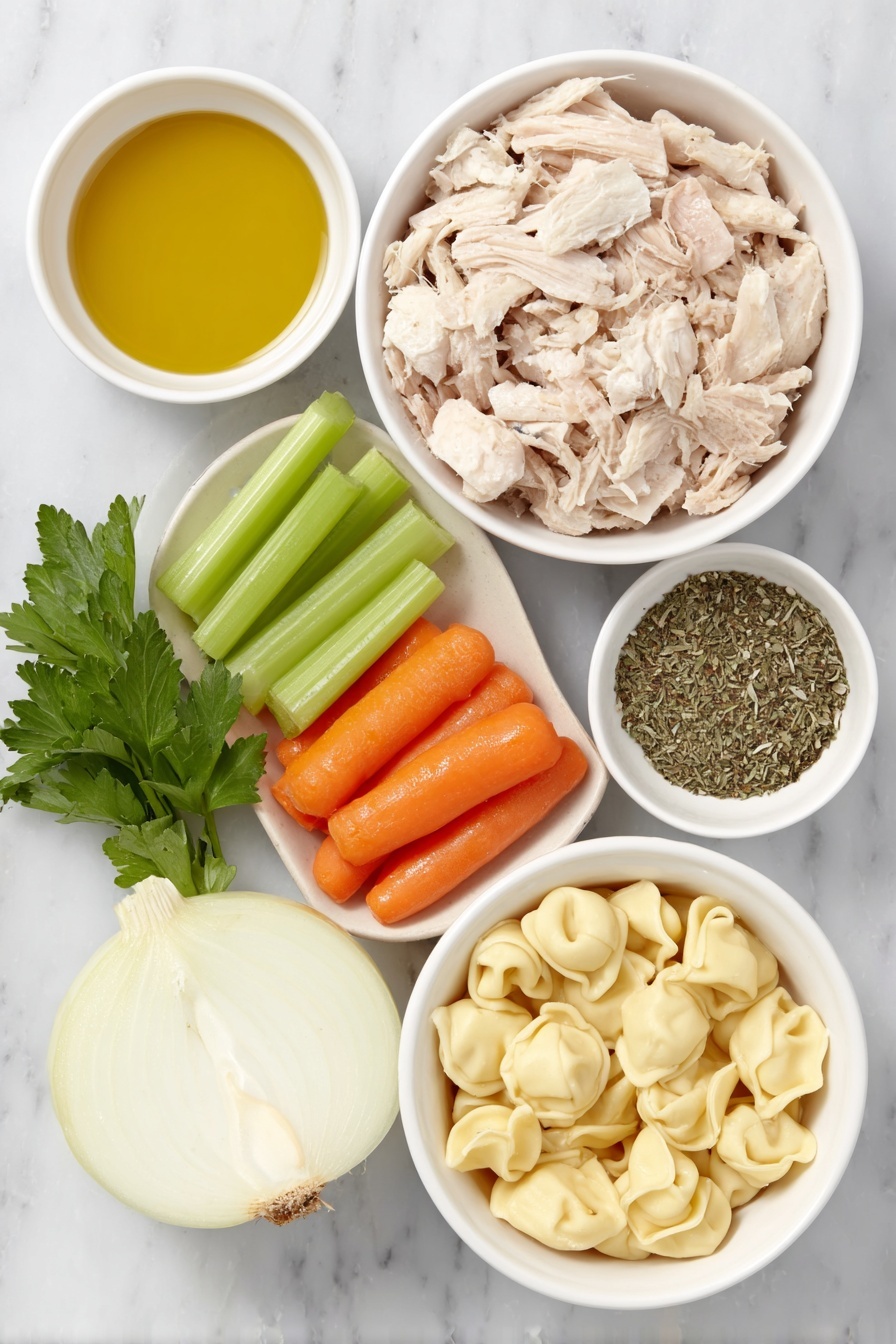 Flat lay of a small white ceramic bowl of golden olive oil, a halved medium yellow onion with layers visible, three bright green celery stalks trimmed and chopped, three vibrant orange carrots peeled and sliced, two peeled garlic cloves, a small white bowl filled with mixed dried Italian herbs, a white ceramic bowl holding light brown shredded cooked chicken, a handful of fresh flat-leaf parsley sprigs, a few uncooked cheese tortellini pasta pieces with folded ring shapes, and a white ceramic bowl filled with golden chicken broth, arranged with perfect symmetry and realistic proportions, placed on a clean white marble surface, soft natural light, photo taken with an iPhone, professional food photography style, fresh ingredients, white ceramic bowls, no bottles, no duplicates, no utensils, no packaging --ar 2:3 --v 7 --p m7354615311229779997 - Chicken Tortellini Soup, Easy Chicken Tortellini Soup, Comforting Tortellini Soup, Homemade Chicken Tortellini Soup, Quick Chicken Tortellini Soup