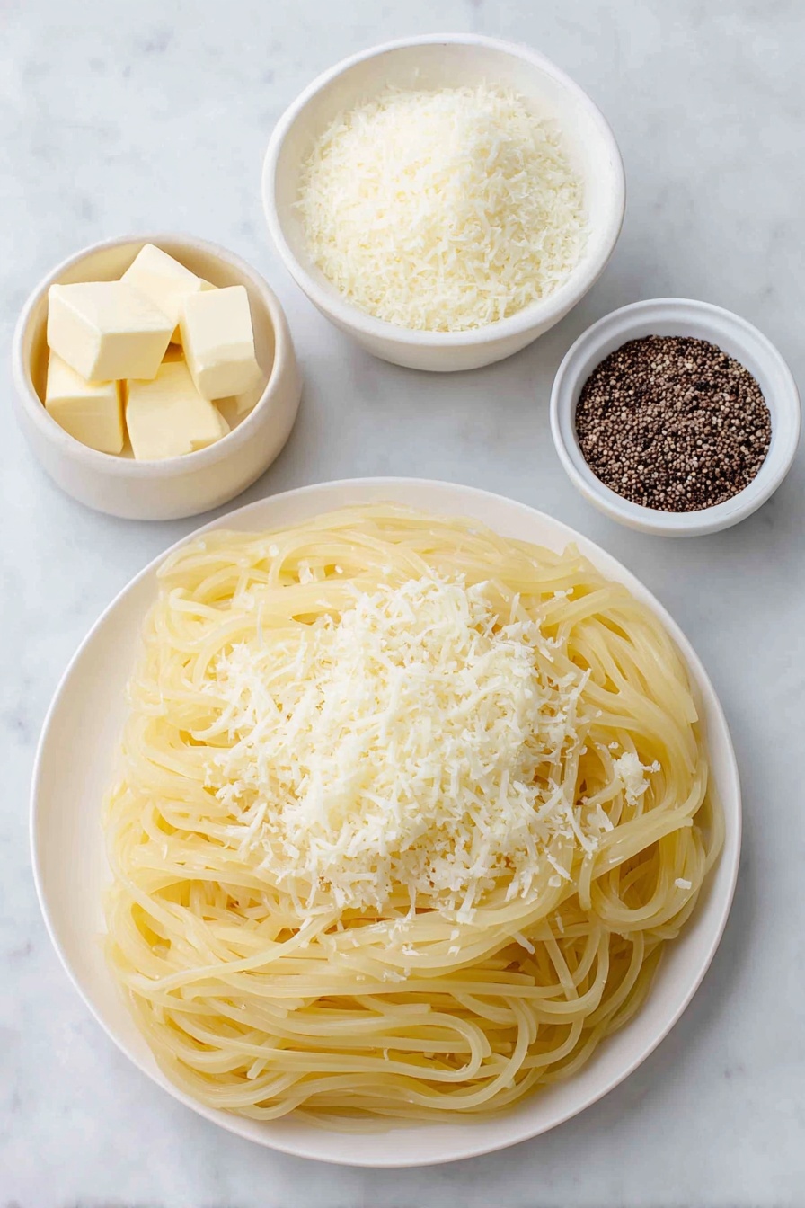 Flat lay of dried bucatini pasta nest, two tablespoons of unsalted butter in a small white ceramic bowl, half cup of freshly grated Pecorino Romano cheese in a simple white plate, cracked black peppercorns scattered neatly beside a small white bowl containing toasted cracked black pepper, placed on a clean white marble surface, soft natural light, photo taken with an iPhone, professional food photography style, fresh ingredients, white ceramic bowls, no bottles, no duplicates, no utensils, no packaging --ar 2:3 --v 7 --p m7354615311229779997 - Easy Cacio e Pepe Pasta, simple Italian pasta dish, quick pasta recipes, beginner-friendly pasta, authentic Cacio e Pepe