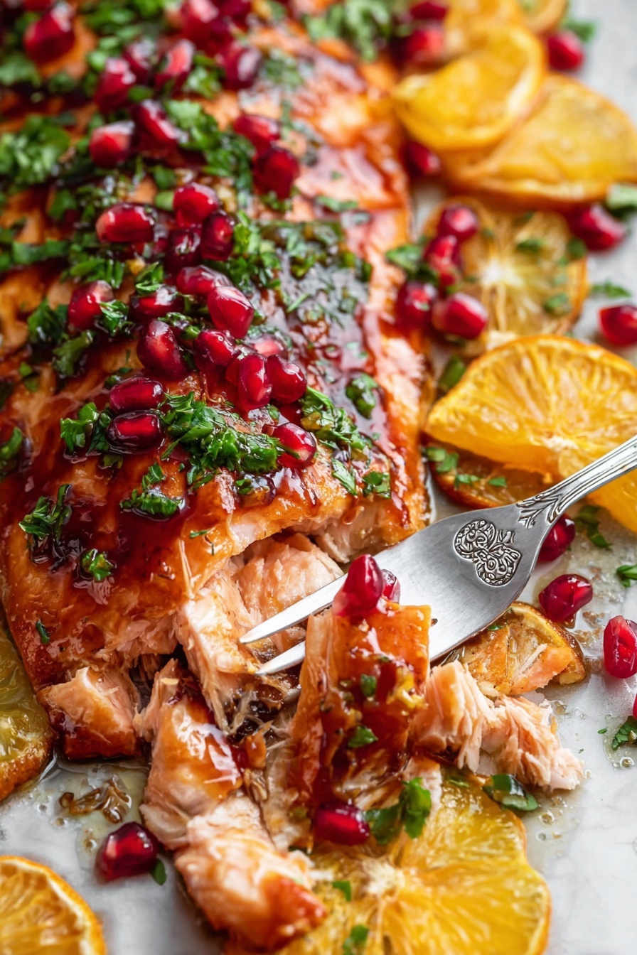 The image shows a close-up of a cooked salmon fillet with a shiny, reddish-brown glaze. On top of the salmon, there are small green herb pieces, bright red pomegranate seeds, and orange slices cut into wedges. The salmon is flaking apart slightly where a silver fork with floral designs holds a piece of the fish. All the elements are arranged over a white marbled surface. The colors are rich and vibrant, with the orange slices and pomegranate seeds standing out against the green herbs and the warm, cooked salmon. Photo taken with an iphone --ar 2:3 --v 7 - Pomegranate Orange Glazed Salmon, citrus salmon glaze, healthy salmon recipes, easy seafood dinner, flavorful salmon dishes