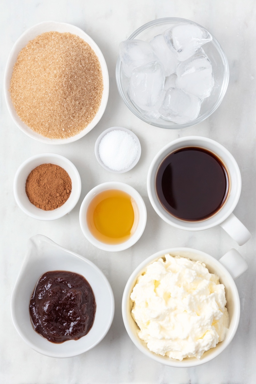 Flat lay of a small mound of light brown sugar, a small white ceramic bowl of clear water, a small white ceramic bowl with thick dark molasses, a small white ceramic bowl of ground ginger powder, a small white ceramic bowl of ground cinnamon powder, a small white ceramic bowl of golden vanilla extract, a double shot of freshly brewed espresso in a simple white ceramic cup, a small handful of clear ice cubes, a small white ceramic bowl filled with creamy oat milk, and a small white ceramic bowl of smooth coconut whipped cream dollop, all arranged symmetrically and naturally on a clean white marble surface, soft natural light, photo taken with an iPhone, professional food photography style, fresh ingredients, white ceramic bowls, no bottles, no duplicates, no utensils, no packaging --ar 2:3 --v 7 --p m7354615311229779997 - Gingerbread Latte, homemade gingerbread latte, spiced coffee drink, holiday latte recipe, cozy winter beverages