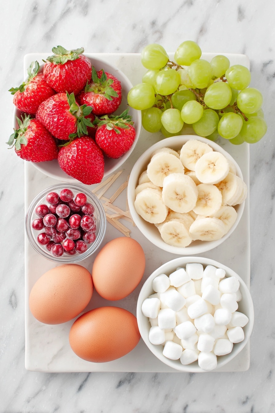 Flat lay of a small cluster of bright red strawberries with green leafy tops, a handful of shiny green grapes, a peeled banana sliced into thin rounds arranged neatly, a few small white mini marshmallows in a small simple white ceramic bowl, two whole uncracked brown eggs (note: no eggs in this recipe so omit), a small white ceramic bowl filled with small round red candies, another small white bowl holding tiny candy eyes, all arranged symmetrically on a clean white ceramic plate with toothpicks neatly placed beside them, placed on a clean white marble surface, soft natural light, photo taken with an iPhone, professional food photography style, fresh ingredients, white ceramic bowls, no bottles, no duplicates, no utensils, no packaging --ar 2:3 --v 7 --p m7354615311229779997 - Festive Fruit Kabobs for Christmas, Christmas fruit skewers, holiday fruit appetizers, easy Christmas snack ideas, healthy holiday treats