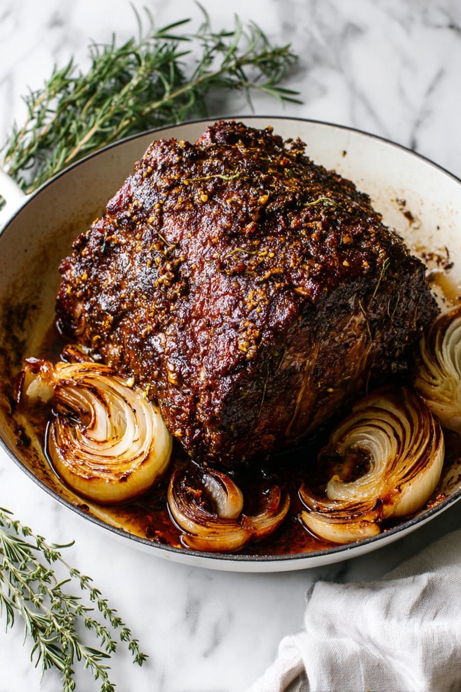 A large, thick piece of roasted meat with a dark brown, crispy, and textured crust sits in the center of a white skillet. The meat’s surface is covered in a spice and herb crust that adds a bumpy texture, with a shiny glaze reflecting light. Surrounding the meat in the pan are several roasted onion halves with caramelized, golden brown layers curling slightly from the heat. The skillet rests on a white marbled surface, with green sprigs of rosemary and thyme arranged beside it, and a white cloth napkin partially visible in the corner. Photo taken with an iphone --ar 2:3 --v 7 - Garlic Herb Prime Rib, Prime Rib Roast with Garlic and Herbs, Juicy Prime Rib Recipes, Holiday Prime Rib, Perfect Prime Rib Cooking Tips