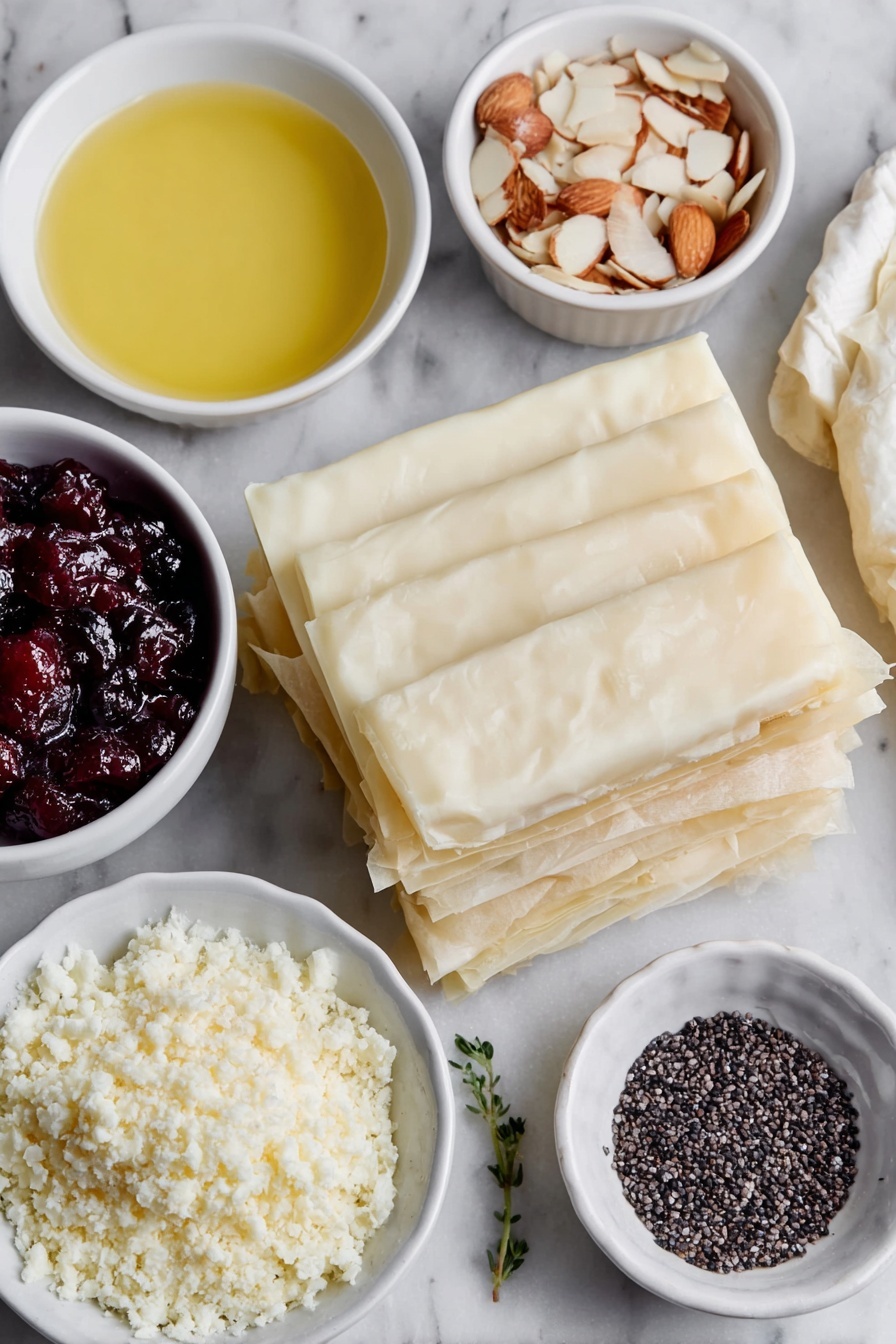 Flat lay of six sheets of thin, delicate frozen filo pastry thawed and stacked neatly, a small white bowl of golden melted butter, several long slices of creamy brie cheese arranged in a simple row, a small white bowl filled with vibrant red cranberry sauce, a small white bowl holding pale beige flaked almonds, a small white bowl with tiny black sesame seeds scattered inside — all placed on a clean white marble surface, soft natural light, photo taken with an iPhone, professional food photography style, fresh ingredients, white ceramic bowls, no bottles, no duplicates, no utensils, no packaging --ar 2:3 --v 7 --p m7354615311229779997 - Cranberry Brie Filo Crackers, festive appetizer recipe, easy holiday appetizers, savory brunch finger foods, cranberry and brie bites