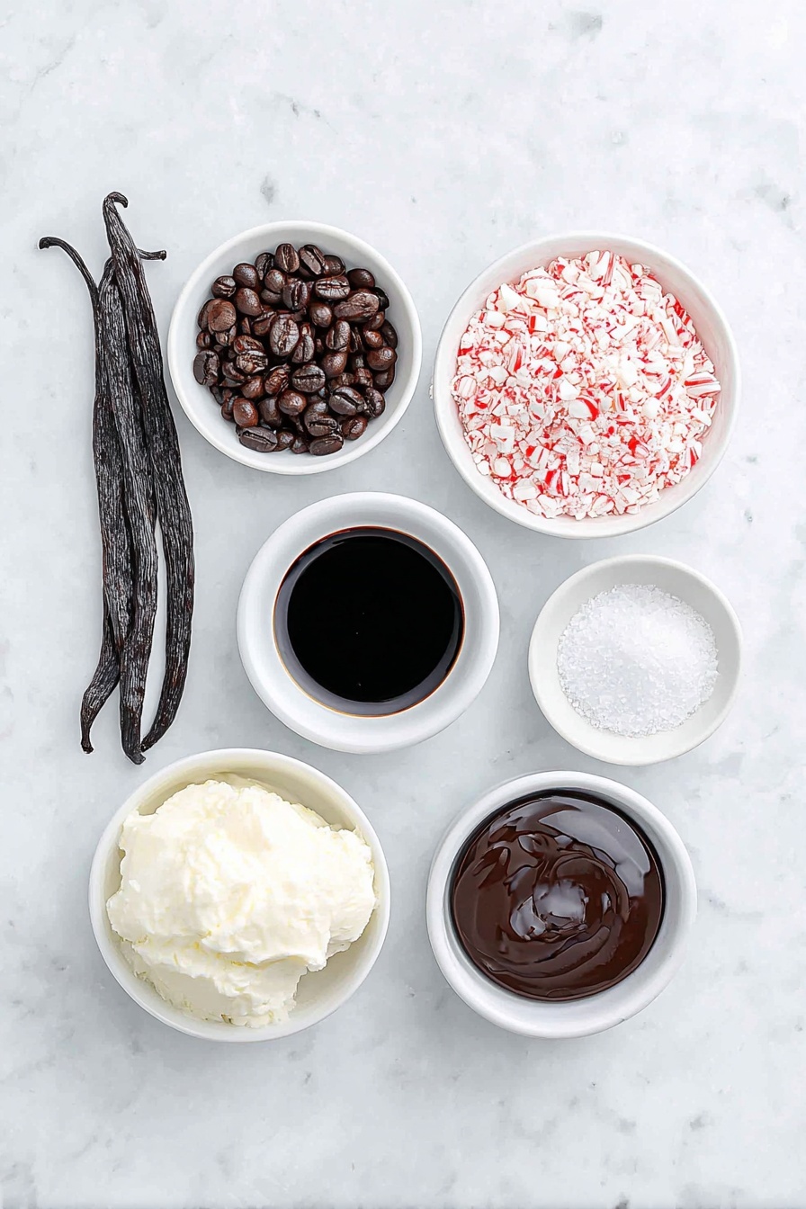 Flat lay of fresh whole vanilla bean pod, two glossy dark roasted espresso beans, a small white ceramic bowl of rich black espresso, a small white ceramic bowl with creamy half & half, a small white ceramic bowl of smooth dark coffee liqueur, a small white ceramic bowl of clear peppermint extract, a small white ceramic bowl filled with crushed red and white candy cane pieces, and a small white ceramic bowl of glossy chocolate syrup, all arranged in perfect symmetry, placed on a clean white marble surface, soft natural light, photo taken with an iPhone, professional food photography style, fresh ingredients, white ceramic bowls, no bottles, no duplicates, no utensils, no packaging --ar 2:3 --v 7 --p m7354615311229779997 - Peppermint Espresso Martini, festive cocktail ideas, holiday espresso drinks, peppermint vodka cocktails, easy holiday cocktails