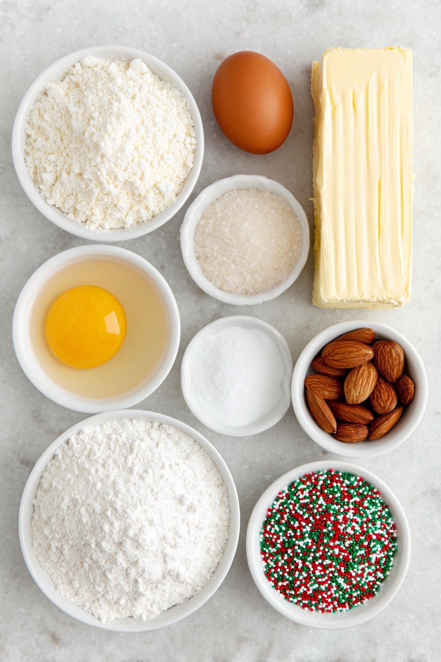 Flat lay of a stick of unsalted butter, a small heap of granulated sugar, one whole brown egg, a few almonds next to a small white bowl of clear almond extract, a small white bowl of pale vanilla extract, a mound of all-purpose flour, a small white bowl containing white cornstarch powder, a small white bowl filled with baking powder, a small white bowl of fine salt, a small white bowl filled with festive red and green nonpareil sprinkles, and three rectangles of cookie dough colored natural white, bright red, and vibrant green, all arranged in perfect symmetry on a clean white marble surface, soft natural light, photo taken with an iPhone, professional food photography style, fresh ingredients, white ceramic bowls, no bottles, no duplicates, no utensils, no packaging --ar 2:3 --v 7 --p m7354615311229779997 - Swirled Christmas Cookies, Christmas Cookie Recipes, Holiday Cookie Ideas, Festive Cookie Baking, Easy Holiday Cookies